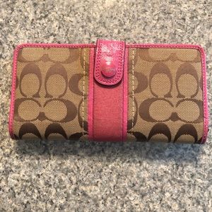 Large used pink and tan Coach wallet